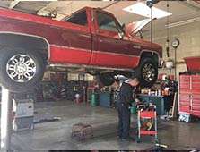 A Technician working on a truck at Glenn's Auto Service