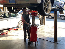 A Technician working on a Chevy's at Glenn's Auto Service